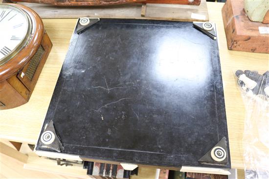 A 1930s ivory and tortoiseshell chess board and a 19th century ivory chess and draughts sets